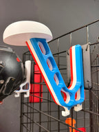 Blue and white sports equipment holder with a helmet on a grid background